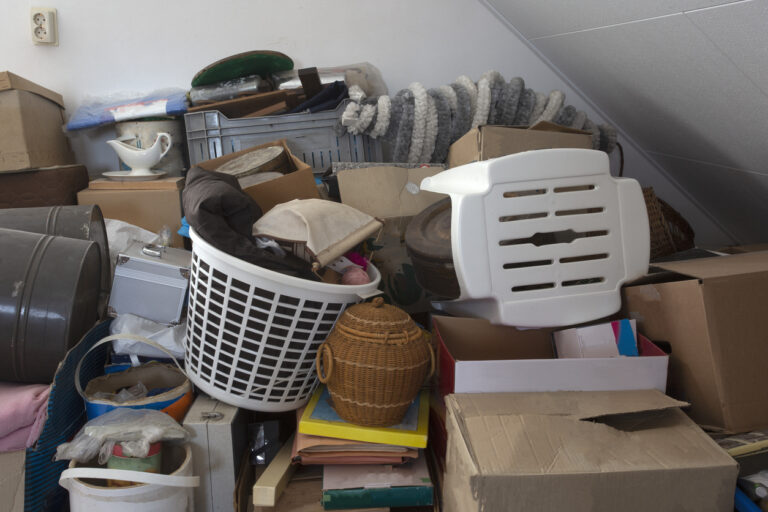 Pile of junk in a house hoarder room pile of household equipment needs clearing out | Ally Waste