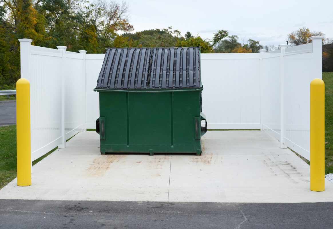 large green commercial dumpster for trash and recycling | Ally Waste
