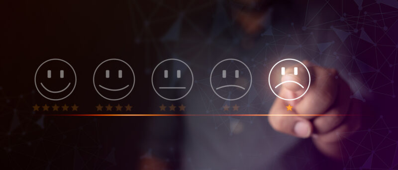 Five-face rating scale with the last face highlighted, signaling a negative customer feedback moment in a UI.
