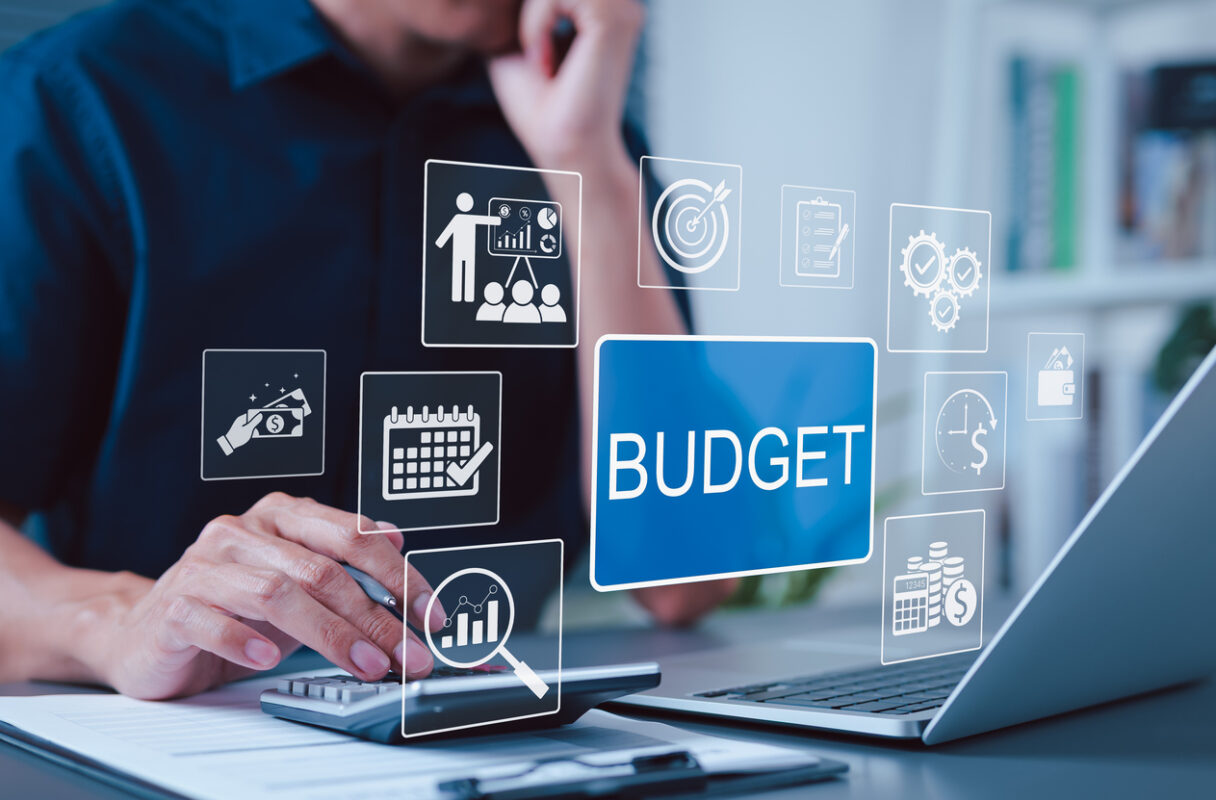 Budget and Financial Planning Concept Businessman using calculator and laptop with icons representing budgeting financial management planning annual expenses personal budget economic strategy | Ally Waste